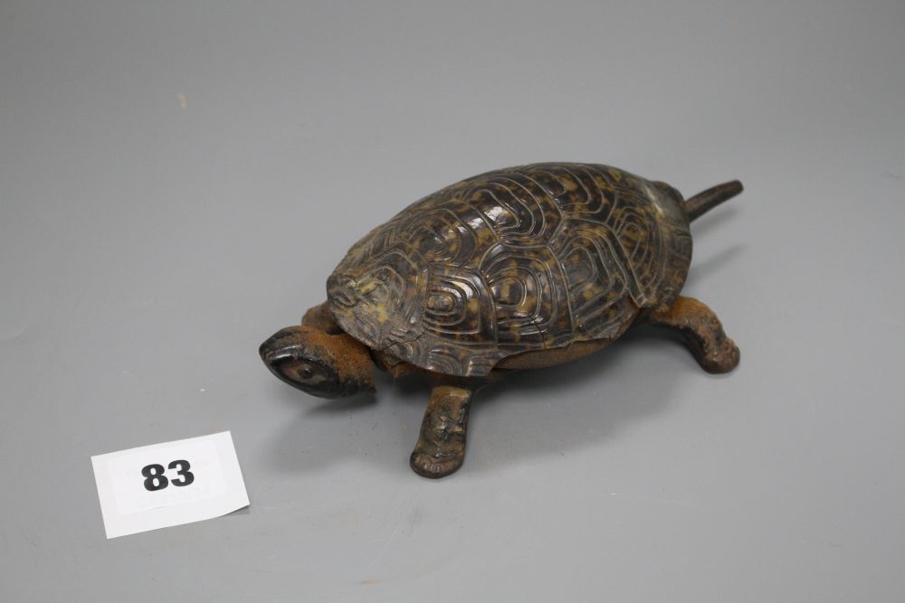 A Victorian cast iron and simulated tortoiseshell table bell, modelled as a tortoise, length 17cm